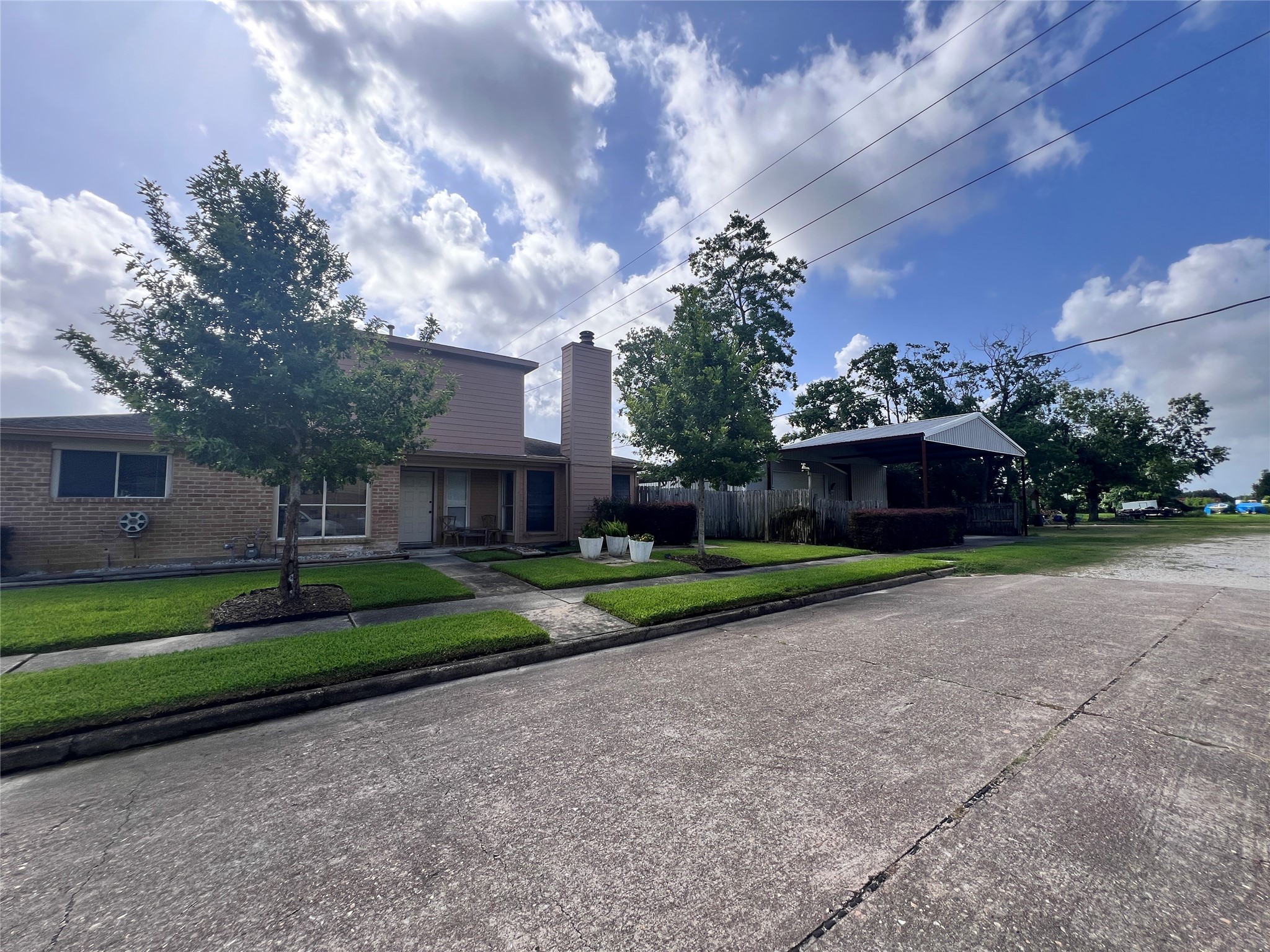8323 East Ridge Drive Houston, TX 77040 - Photo 31 of 31 a view of a house with a yard and large trees