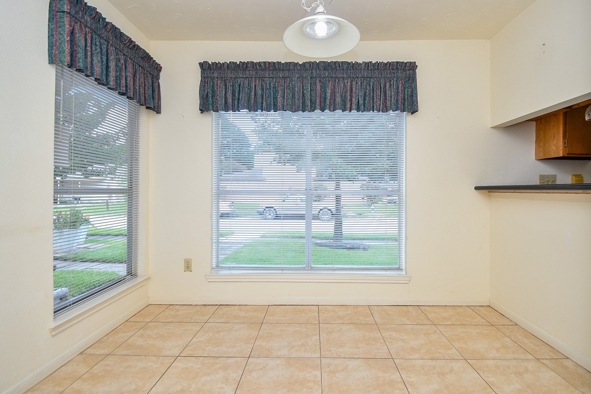 8323 East Ridge Drive Houston, TX 77040 - Photo 10 of 31 a view of a hallway with wooden floor and a bathroom