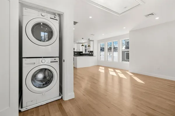 a view of a kitchen with washer and dryer