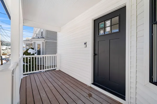 a view of entryway with wooden floor