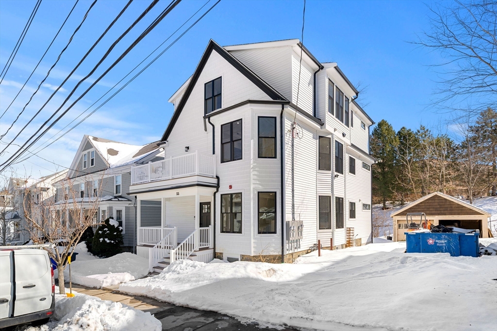 55 Dustin Street, Unit 3 Boston, MA 02135 - Photo 22 of 22 a view of a white house with a yard and sitting space