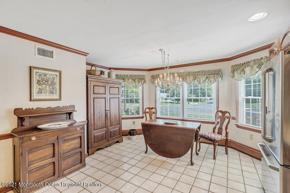 50 Lone Oak Road Middletown, NJ 07748 - Photo 1 of 38 a living room with furniture and large windows