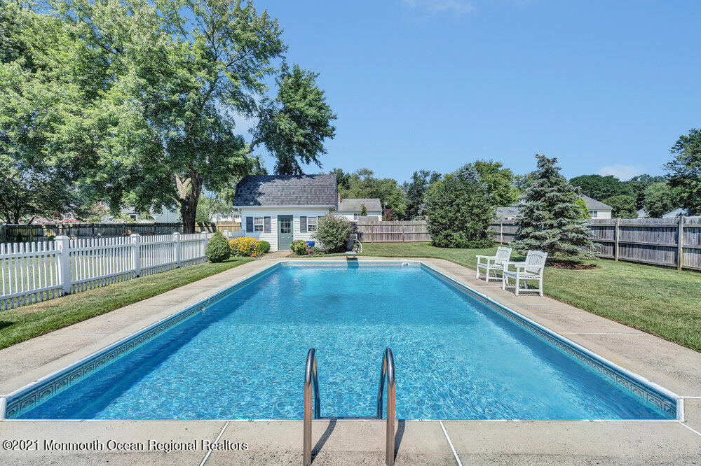 50 Lone Oak Road Middletown, NJ 07748 - Photo 13 of 38 a view of a swimming pool with a patio