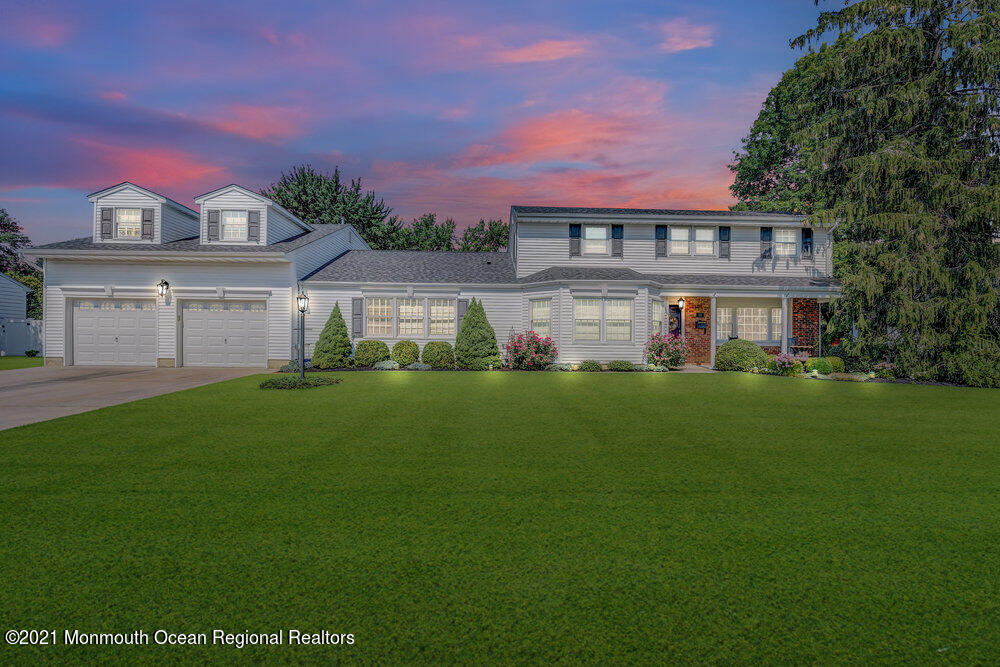 50 Lone Oak Road Middletown, NJ 07748 - Photo 14 of 38 a front view of a house with a garden and plants