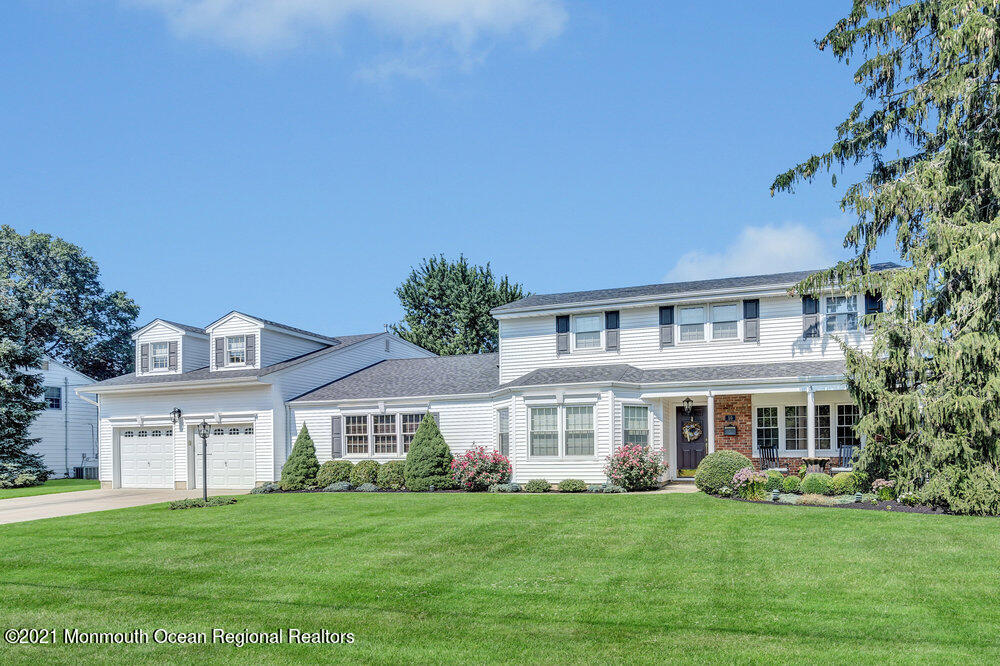 50 Lone Oak Road Middletown, NJ 07748 - Photo 15 of 38 a front view of a house with a garden
