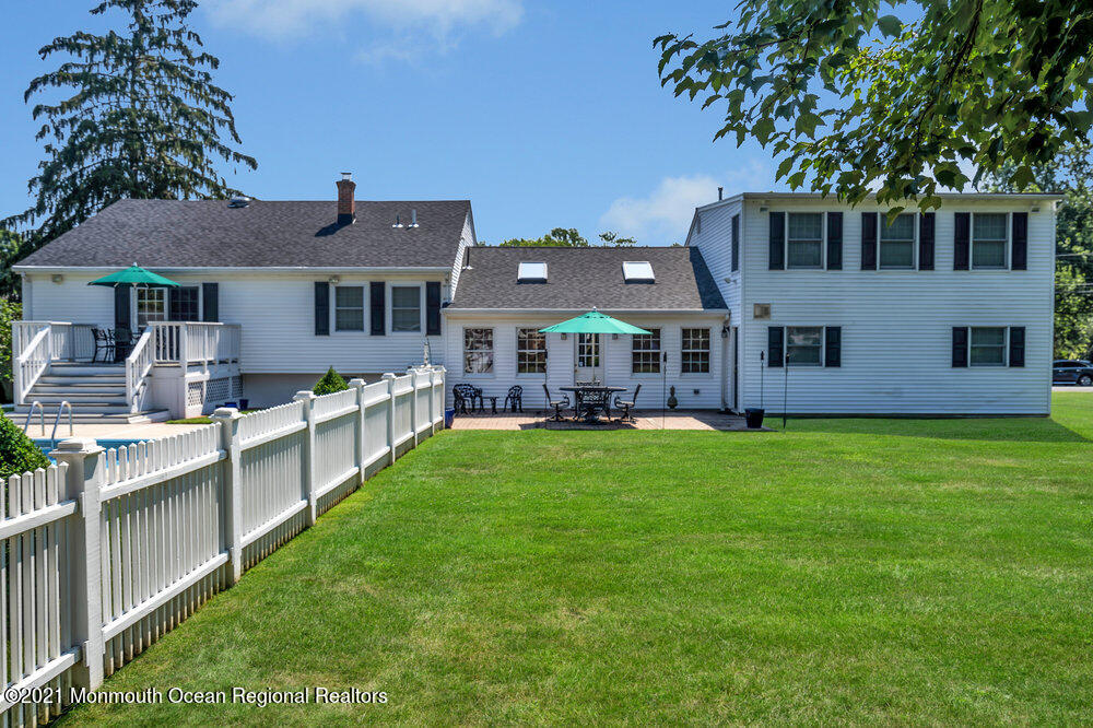 50 Lone Oak Road Middletown, NJ 07748 - Photo 16 of 38 a front view of a house with a garden and yard