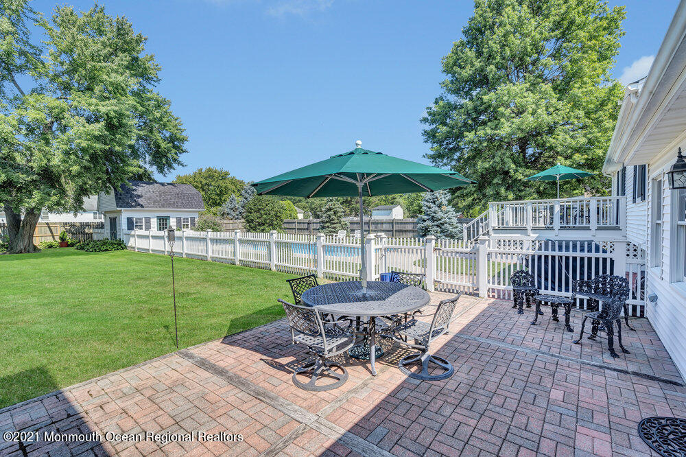 50 Lone Oak Road Middletown, NJ 07748 - Photo 17 of 38 a view of a patio with a table and chairs