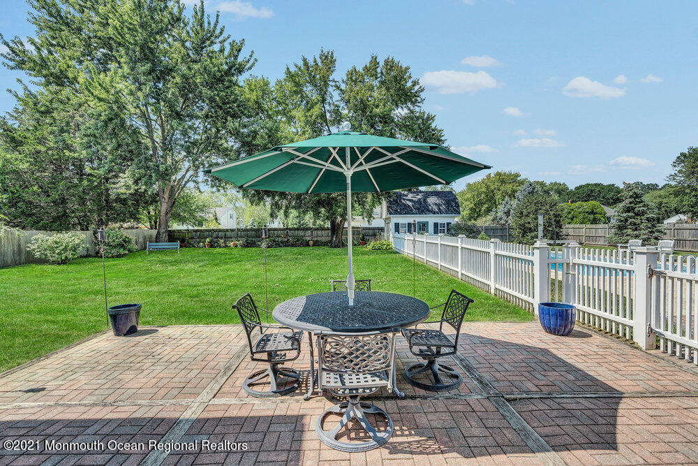 50 Lone Oak Road Middletown, NJ 07748 - Photo 18 of 38 a patio with table and chairs