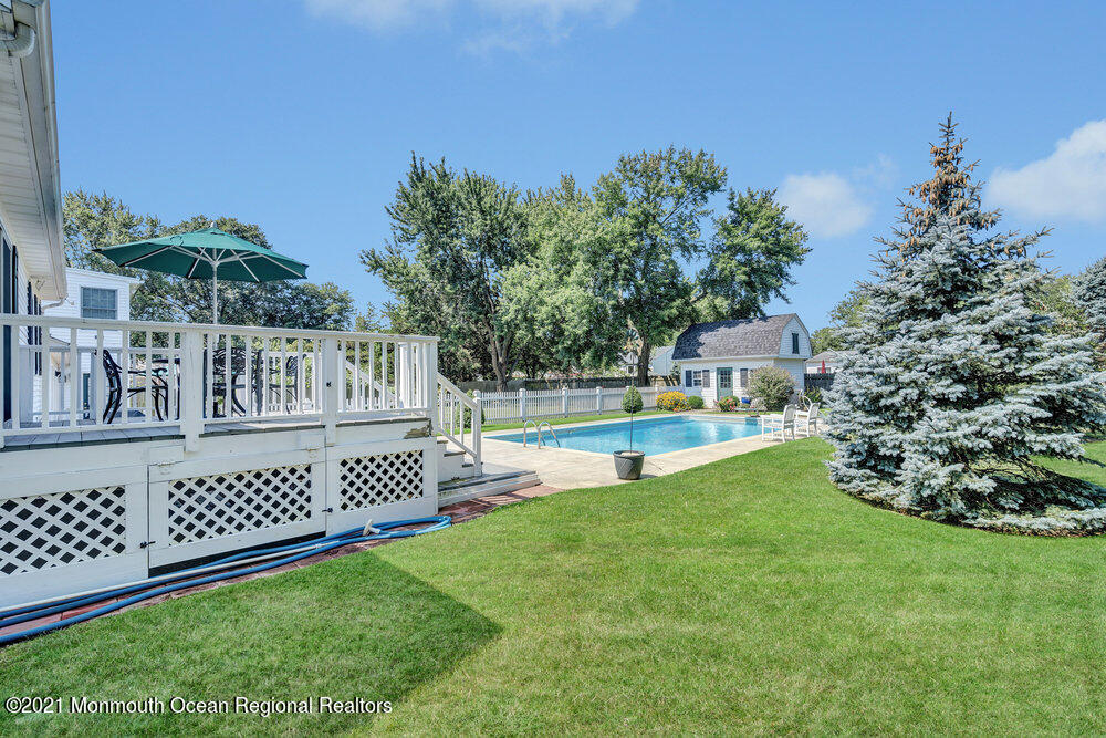 50 Lone Oak Road Middletown, NJ 07748 - Photo 19 of 38 a view of a deck with a yard