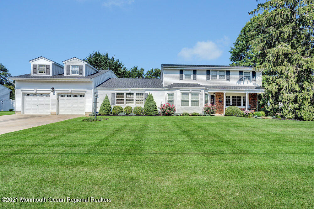 50 Lone Oak Road Middletown, NJ 07748 - Photo 20 of 38 a front view of a house with a yard