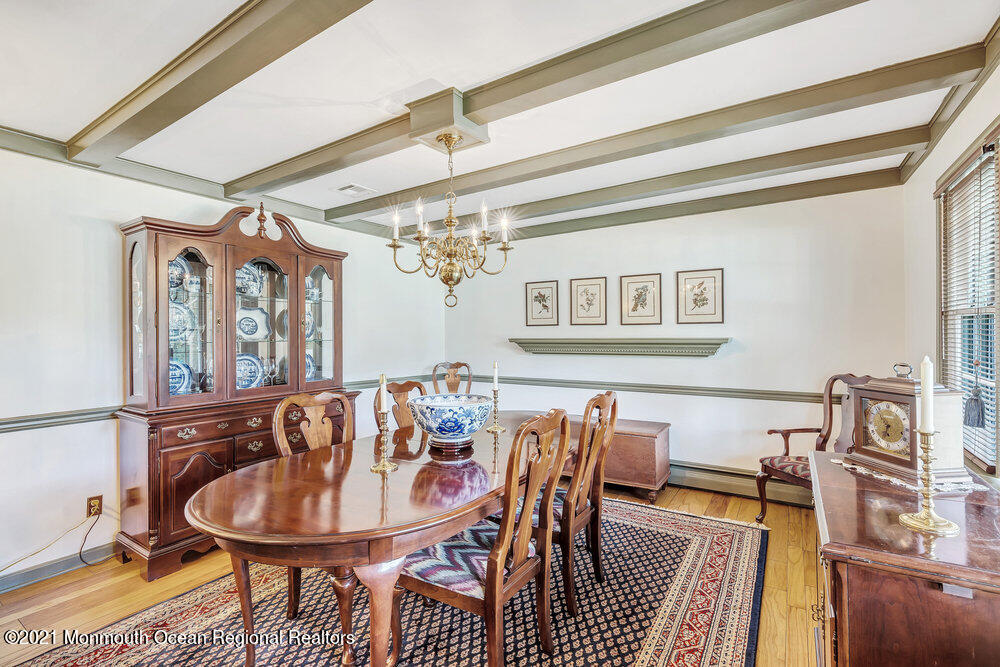 50 Lone Oak Road Middletown, NJ 07748 - Photo 23 of 38 a view of a dining room with furniture and chandelier