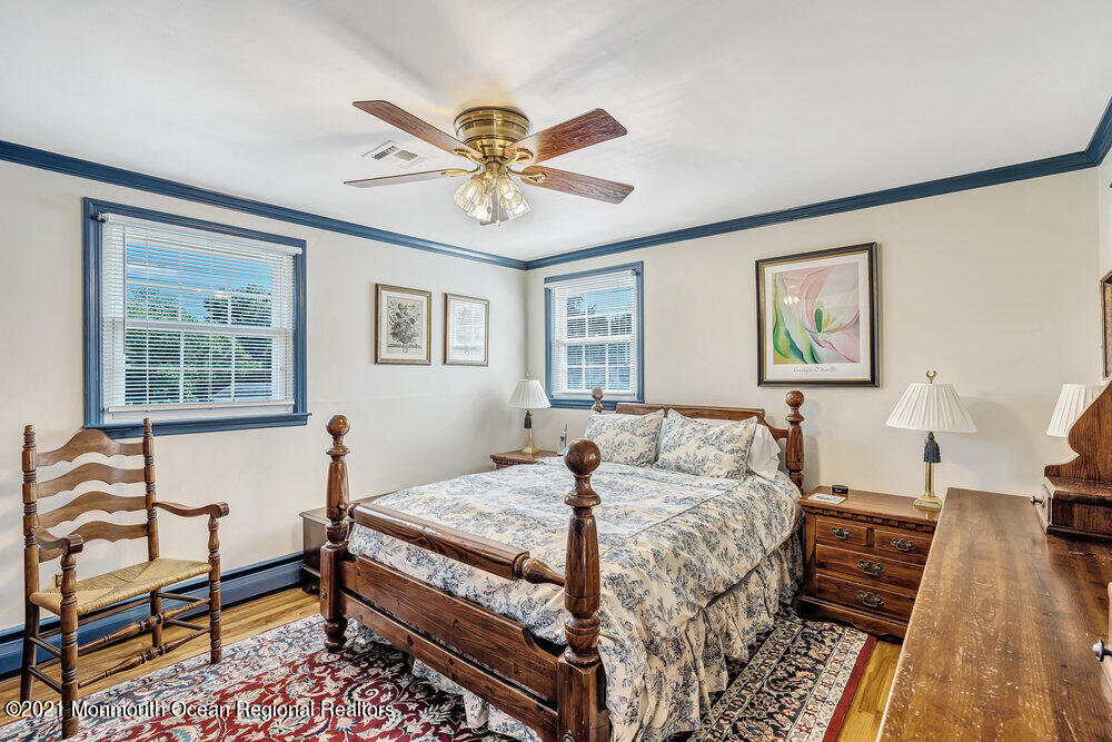 50 Lone Oak Road Middletown, NJ 07748 - Photo 3 of 38 a bedroom with a bed and wooden floor