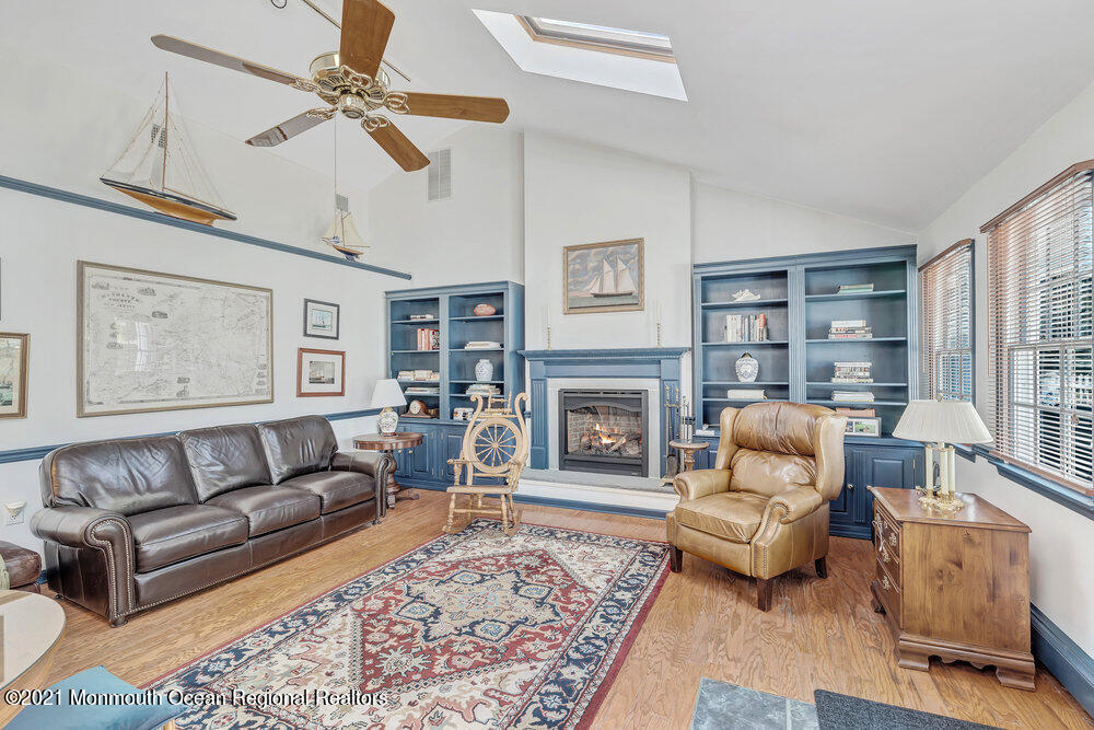 50 Lone Oak Road Middletown, NJ 07748 - Photo 31 of 38 a living room with furniture and a fireplace