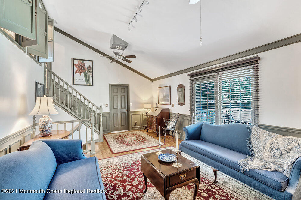 50 Lone Oak Road Middletown, NJ 07748 - Photo 34 of 38 a living room with furniture and a table