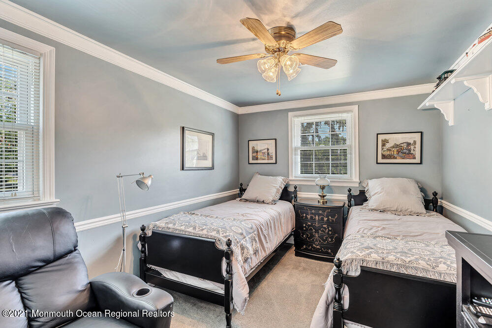 50 Lone Oak Road Middletown, NJ 07748 - Photo 5 of 38 a bedroom with a bed and wooden floor