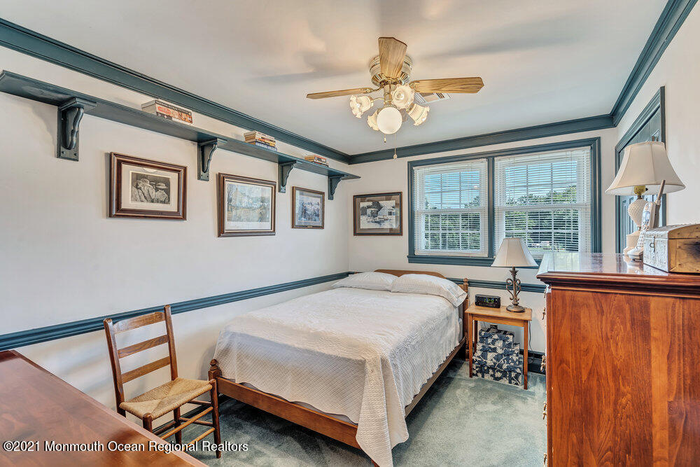 50 Lone Oak Road Middletown, NJ 07748 - Photo 6 of 38 a bed room with a bed and a chandelier