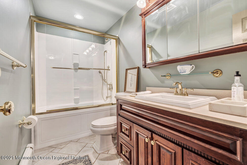 50 Lone Oak Road Middletown, NJ 07748 - Photo 8 of 38 a bathroom with a sink a toilet and shower