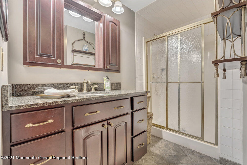 50 Lone Oak Road Middletown, NJ 07748 - Photo 9 of 38 a bathroom with a granite countertop sink mirror and double