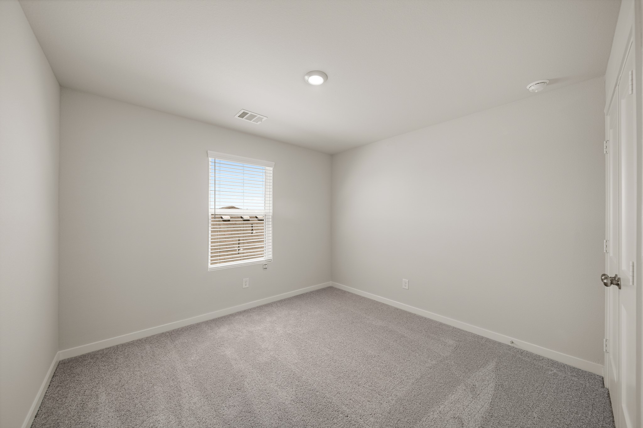 325 Bennett Street Angleton, TX 77515 - Photo 19 of 28 a view of an empty room with a window