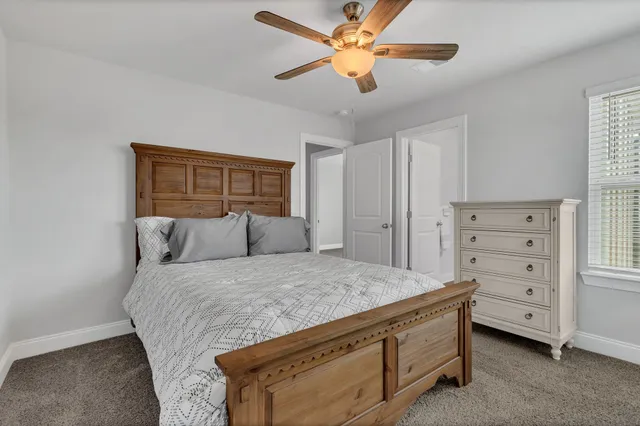 a bedroom with a bed and a dresser