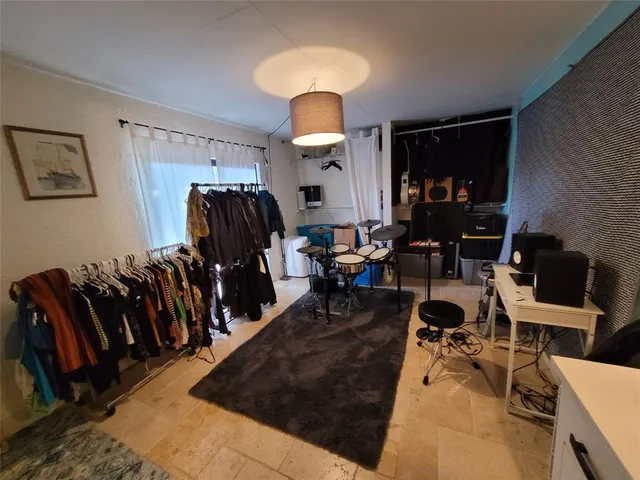 a living room with lots of gym equipment