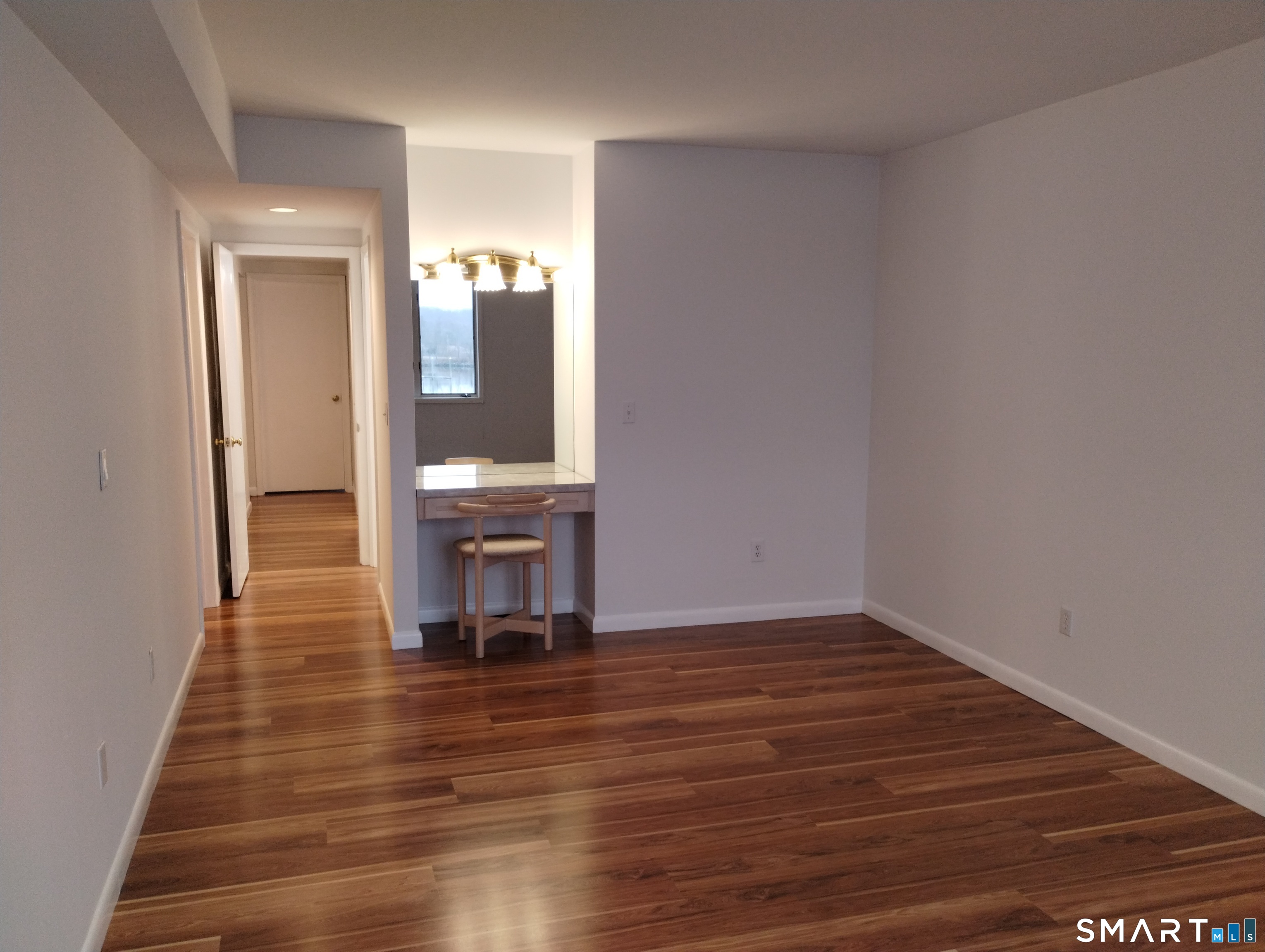 523 Popes Island Road, Unit 523 Milford, CT 06461 - Photo 16 of 33 a view of a room with wooden floor