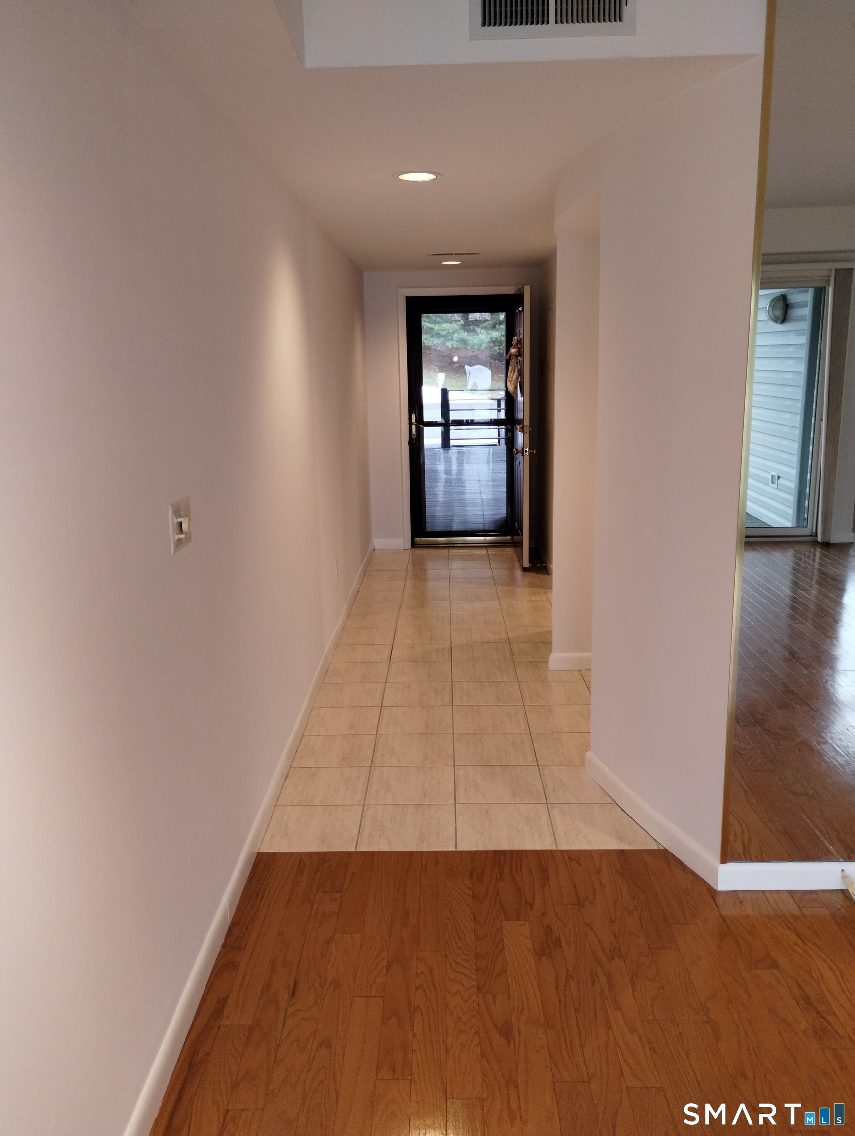 523 Popes Island Road, Unit 523 Milford, CT 06461 - Photo 19 of 33 wooden floor in an empty room with a window