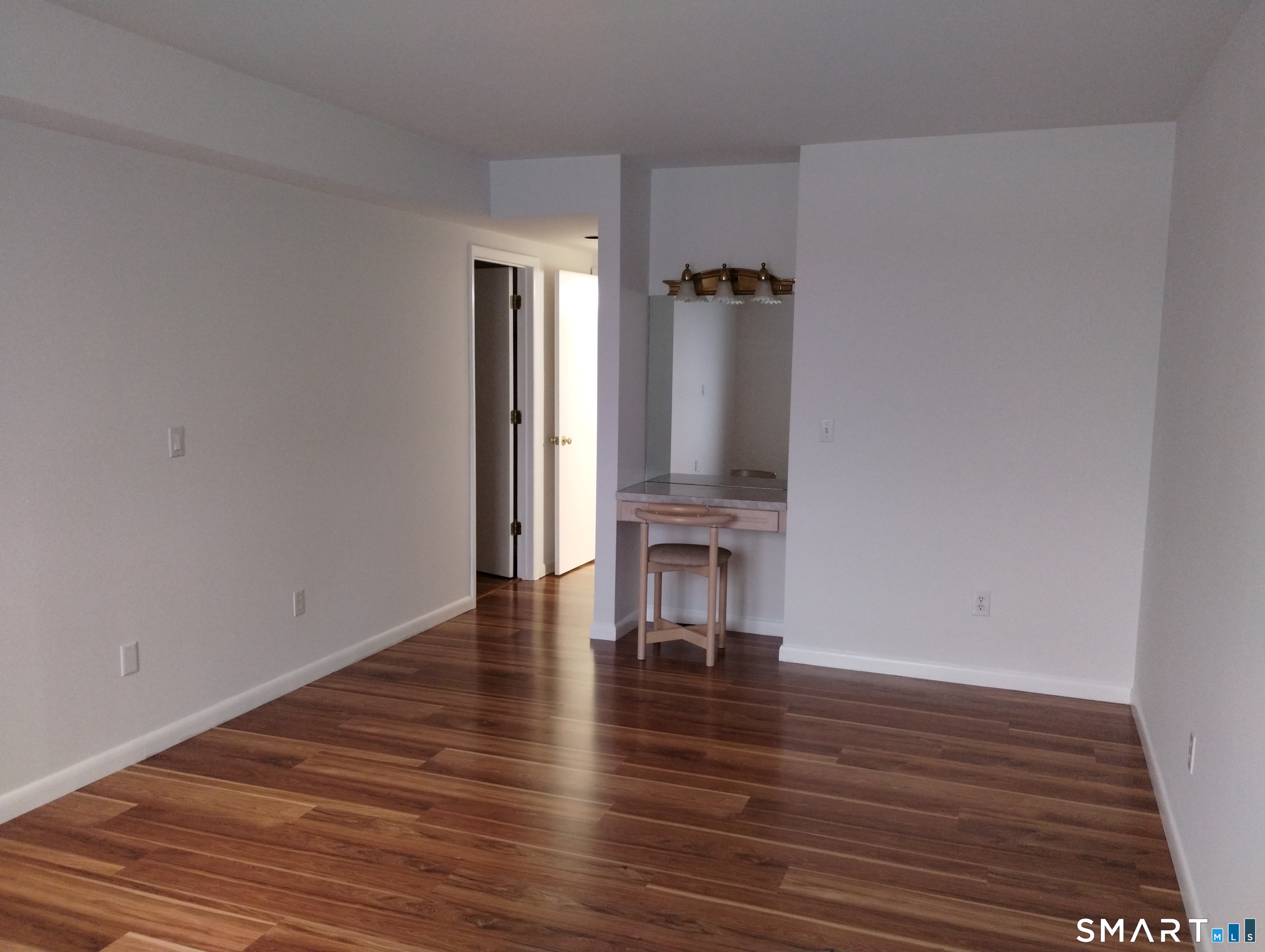 523 Popes Island Road, Unit 523 Milford, CT 06461 - Photo 22 of 33 a view of empty room with wooden floor