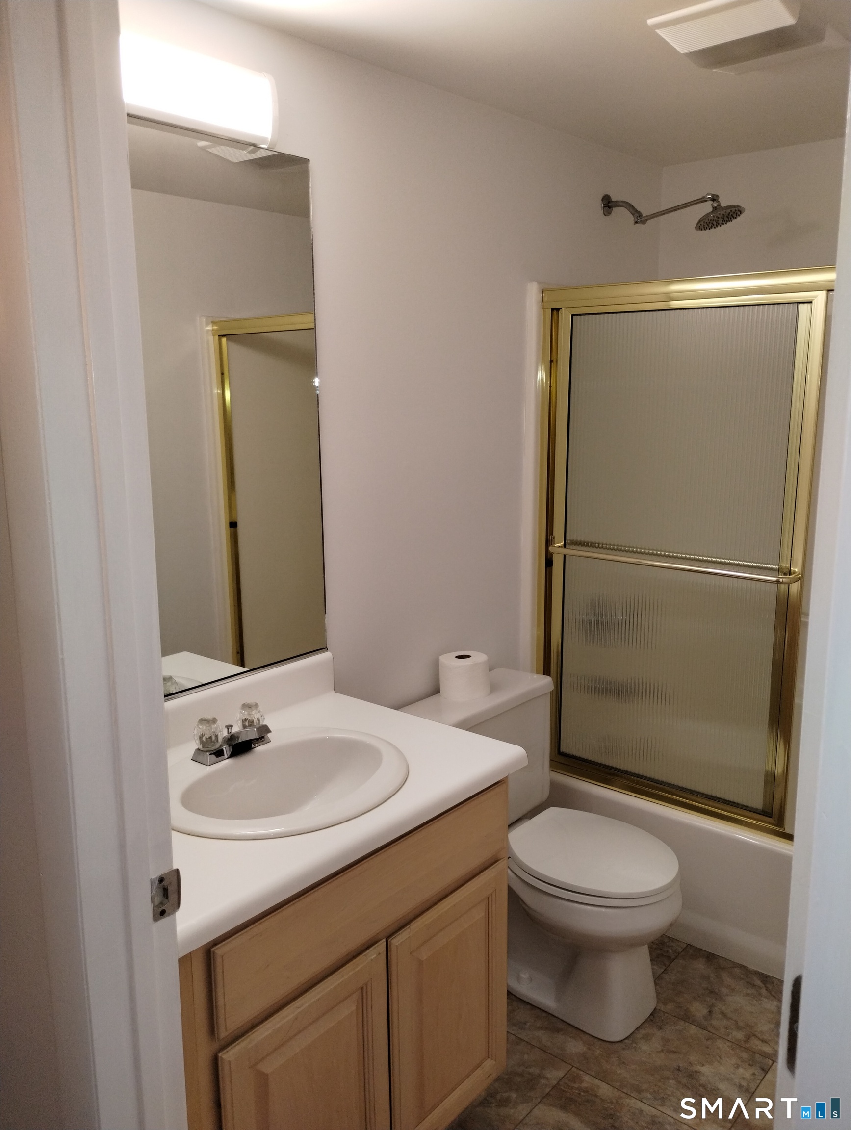 523 Popes Island Road, Unit 523 Milford, CT 06461 - Photo 23 of 33 a bathroom with a sink toilet and shower