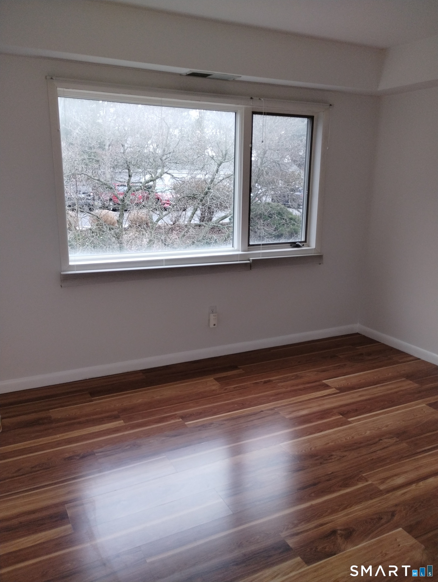523 Popes Island Road, Unit 523 Milford, CT 06461 - Photo 25 of 33 a view of a room with wooden floor and window