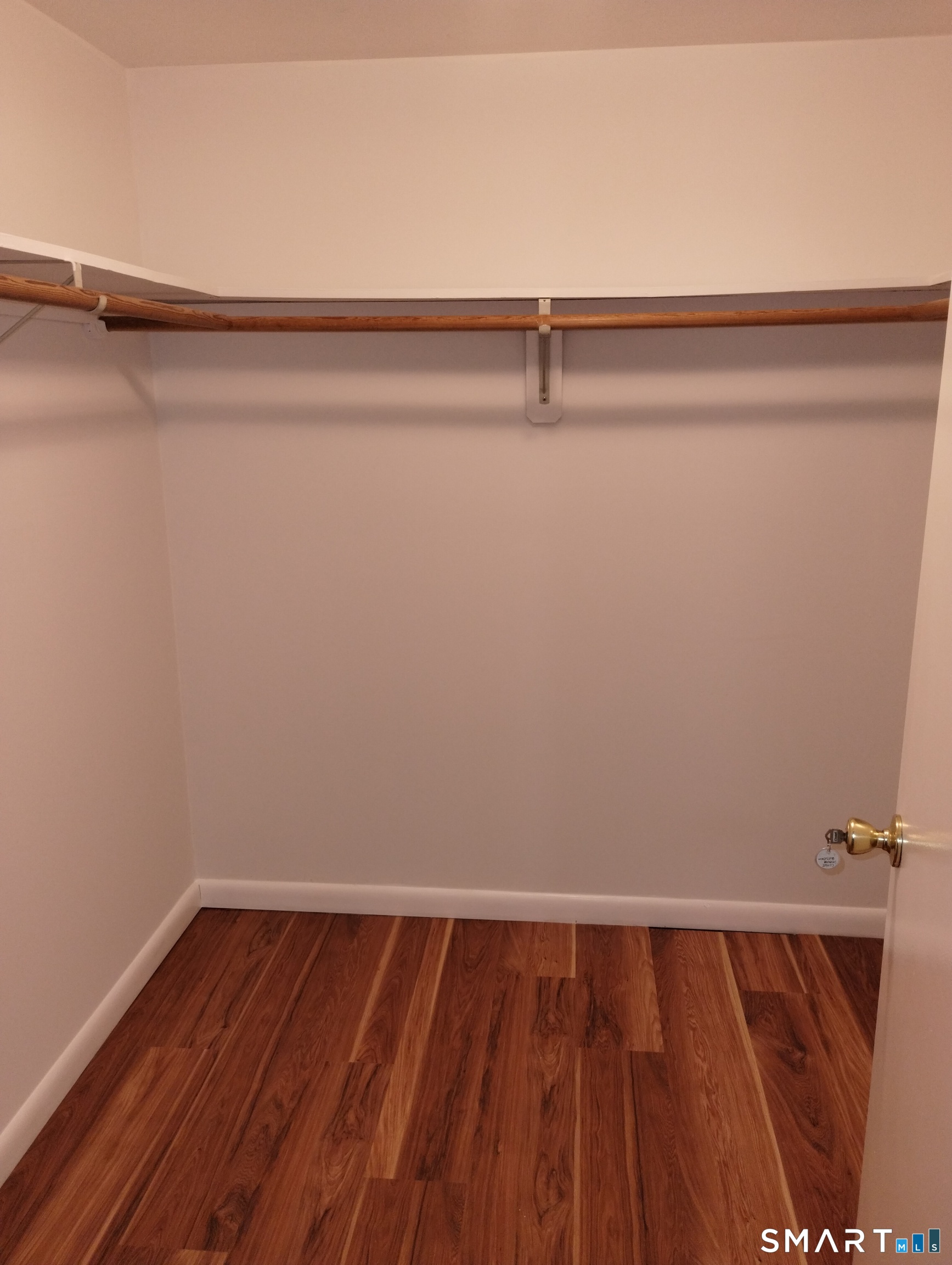 523 Popes Island Road, Unit 523 Milford, CT 06461 - Photo 27 of 33 a view of a room with wooden floor