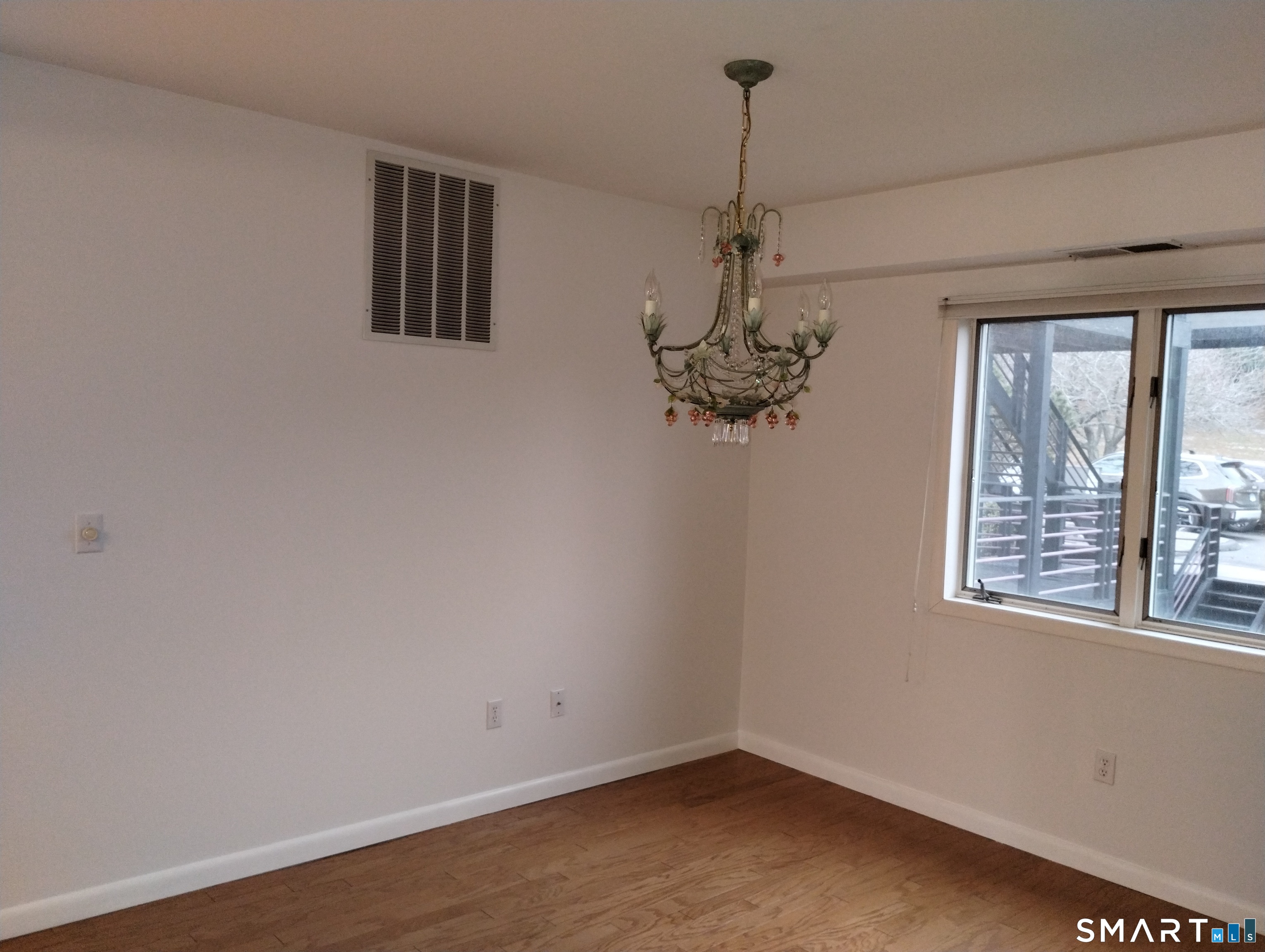523 Popes Island Road, Unit 523 Milford, CT 06461 - Photo 30 of 33 a view of a room with a large window and chandelier