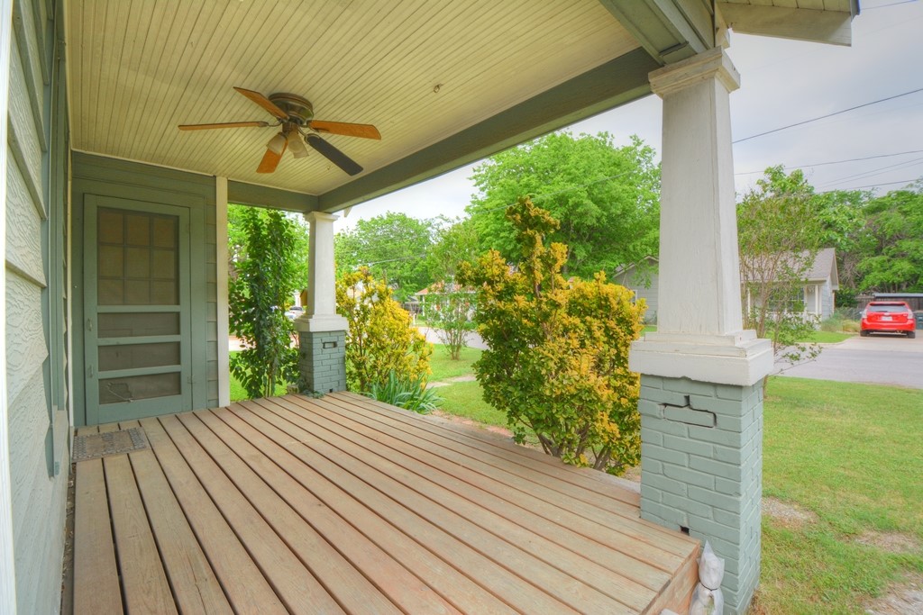 a view of a room with balcony and wooden floor