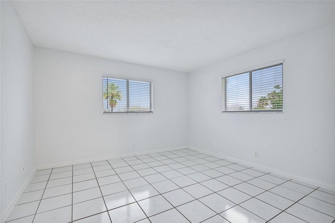 253 South Cypress Road, Unit 234 Pompano Beach, FL 33060 - Photo 13 of 15 a view of an empty room and window