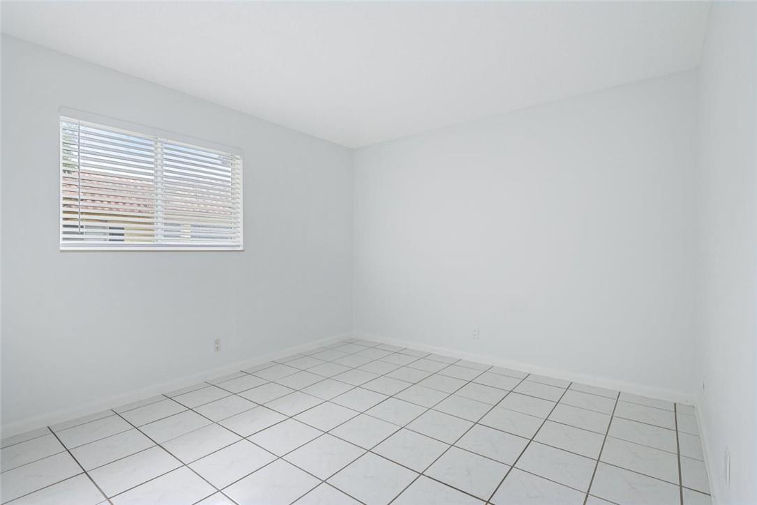 253 South Cypress Road, Unit 234 Pompano Beach, FL 33060 - Photo 15 of 15 a view of an empty room and window