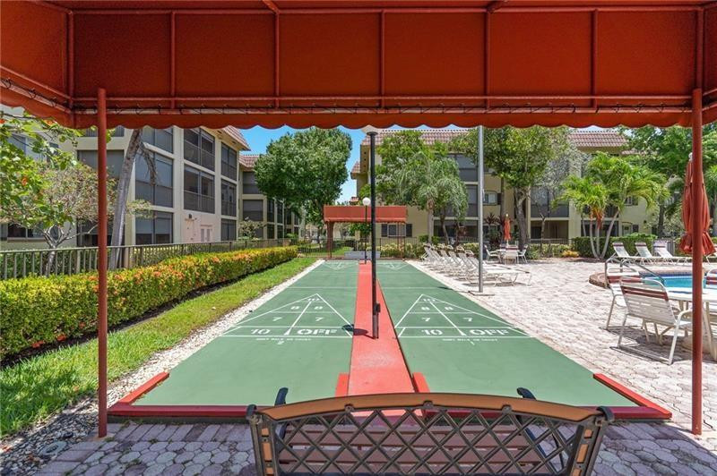 253 South Cypress Road, Unit 234 Pompano Beach, FL 33060 - Photo 6 of 15 a view of a park with a small yard