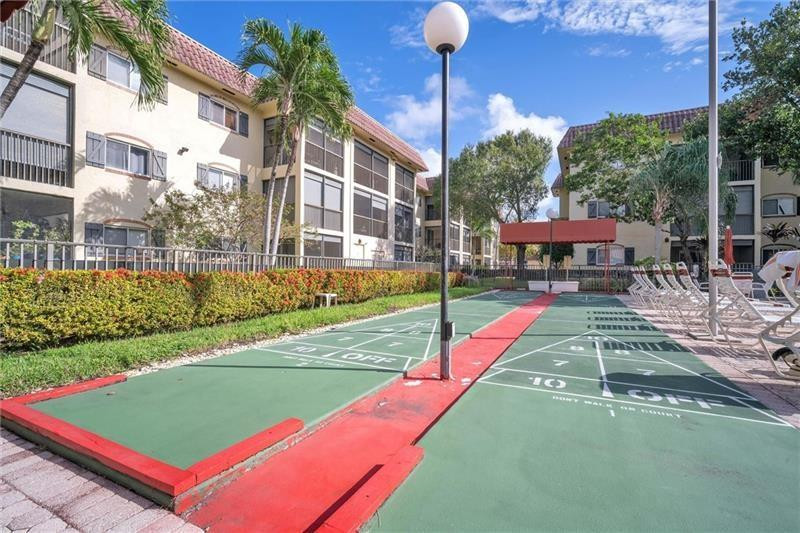 253 South Cypress Road, Unit 234 Pompano Beach, FL 33060 - Photo 9 of 15 a view of an outdoor space yard patio and swimming pool