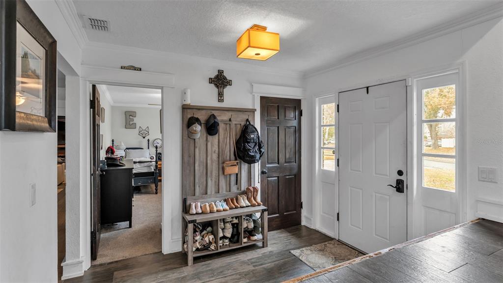4623 Kings Point Court Lakeland, FL 33813 - Photo 22 of 61 a view of an entryway with wooden floor and a livingroom view