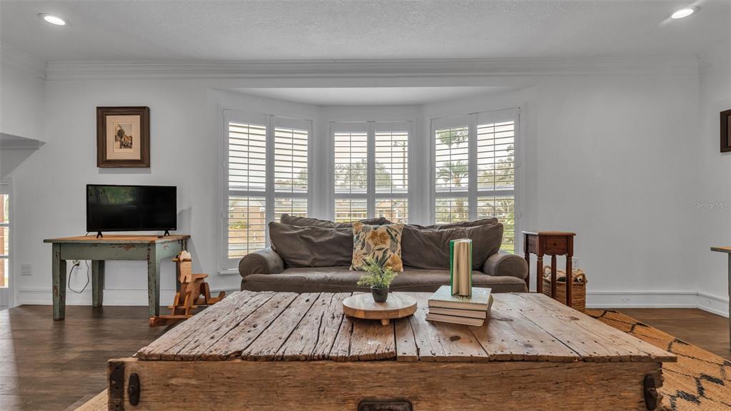 4623 Kings Point Court Lakeland, FL 33813 - Photo 25 of 61 a living room with furniture and a flat screen tv