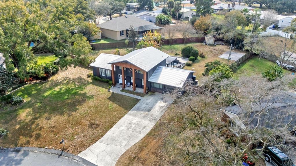 4623 Kings Point Court Lakeland, FL 33813 - Photo 3 of 61 an aerial view of a house with a yard basket ball court and outdoor seating
