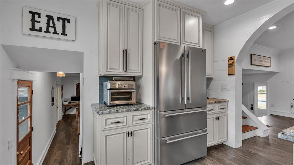 4623 Kings Point Court Lakeland, FL 33813 - Photo 31 of 61 a kitchen with stainless steel appliances and refrigerator