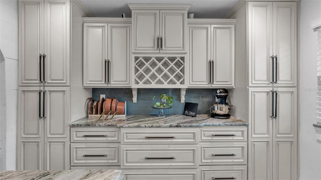 4623 Kings Point Court Lakeland, FL 33813 - Photo 33 of 61 a view of kitchen with wooden cabinets and a refrigerator