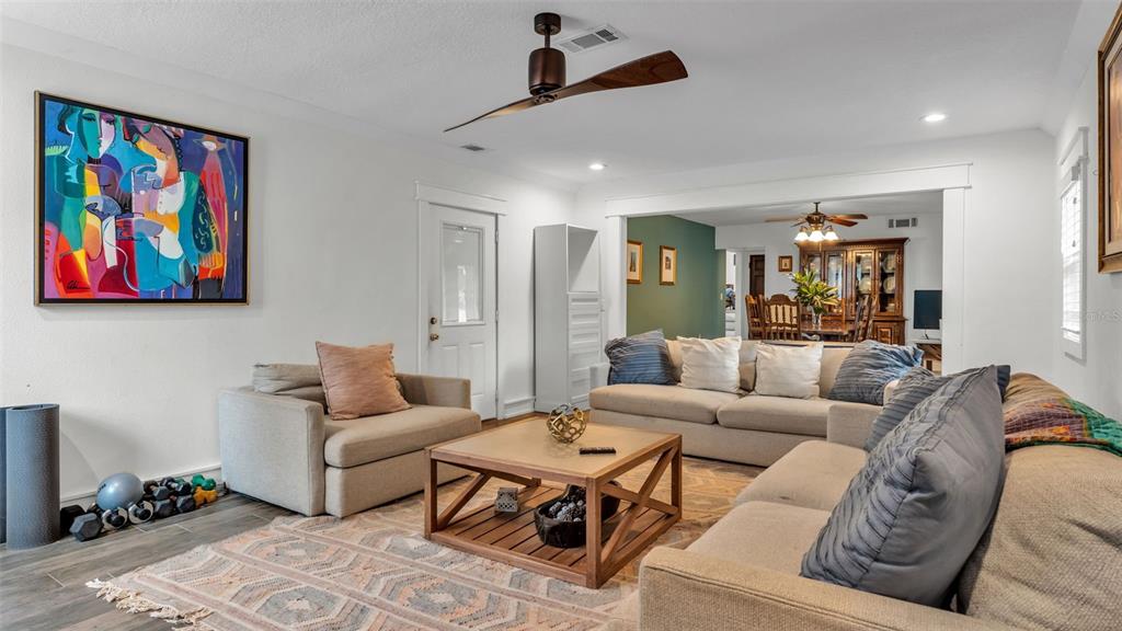 4623 Kings Point Court Lakeland, FL 33813 - Photo 48 of 61 a living room with furniture and painting on the wall