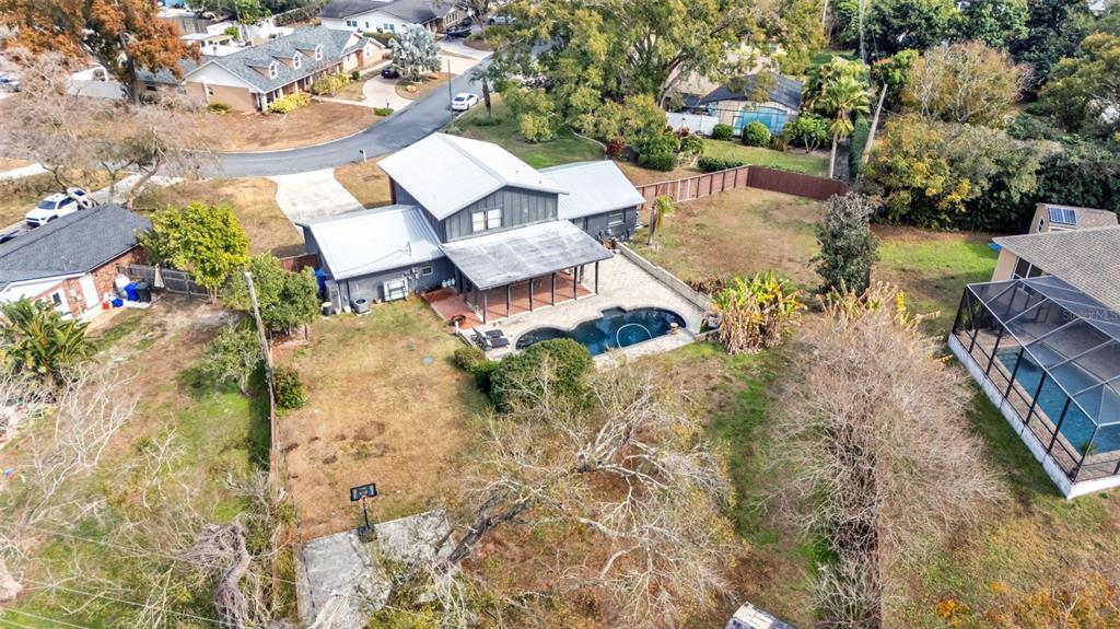 4623 Kings Point Court Lakeland, FL 33813 - Photo 8 of 61 an aerial view of a house with yard and seating space