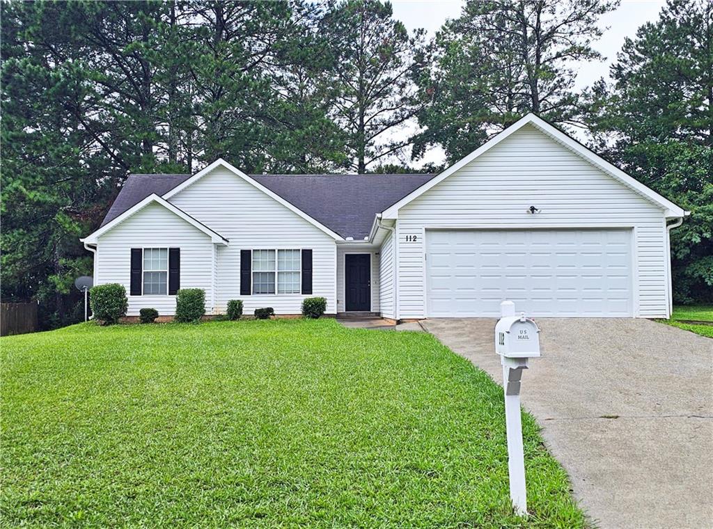 112 Villa Rosa Ridge Temple, GA 30179 - Photo 1 of 1 a view of a yard in front view of a house and garage