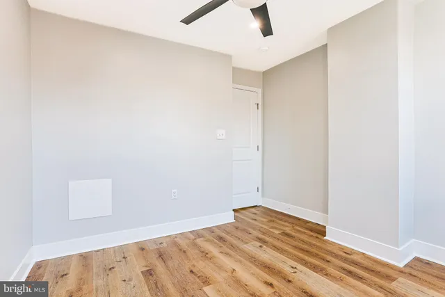 an empty room with a empty space and a window