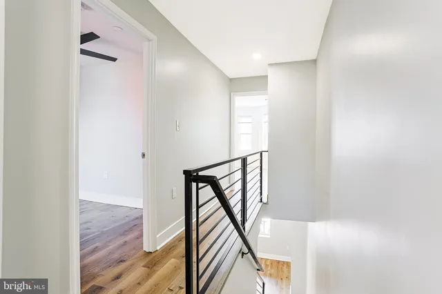 a view of staircase with wooden floor