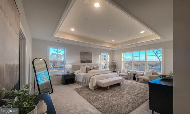 a bed room with a bed and a potted plant