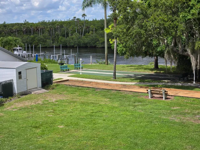 a view of a swimming pool and a yard