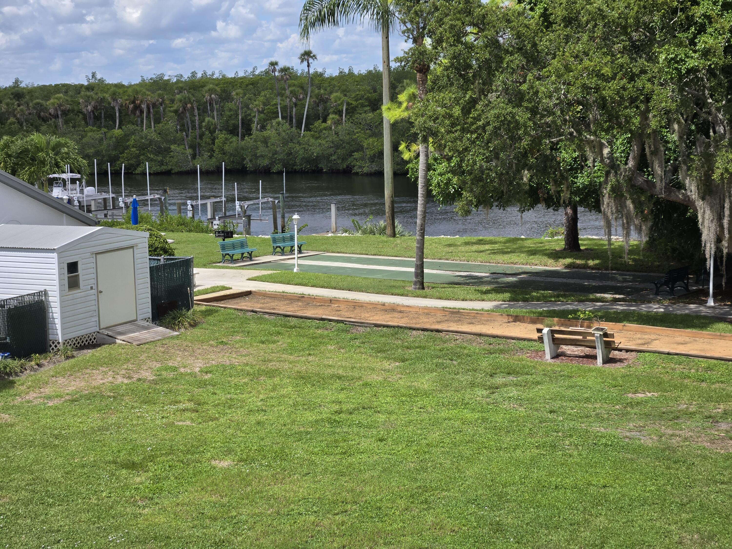 a view of a swimming pool and a yard